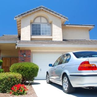 Car in the Driveway Outside of a Home